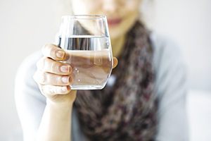 Young woman drinking water